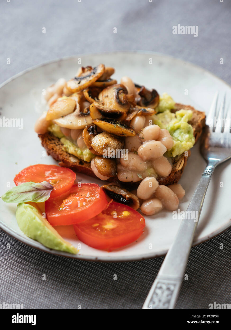 Avocado Toast with White Beans and Mushrooms Stock Photo Alamy