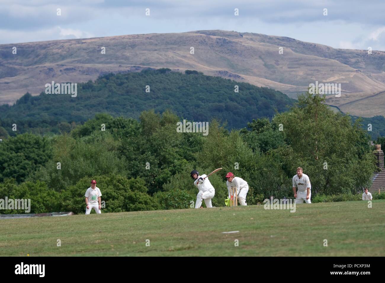 A batsman hits out in the second eleven match between Dinting and Stalybridge St Paul's. Stock Photo