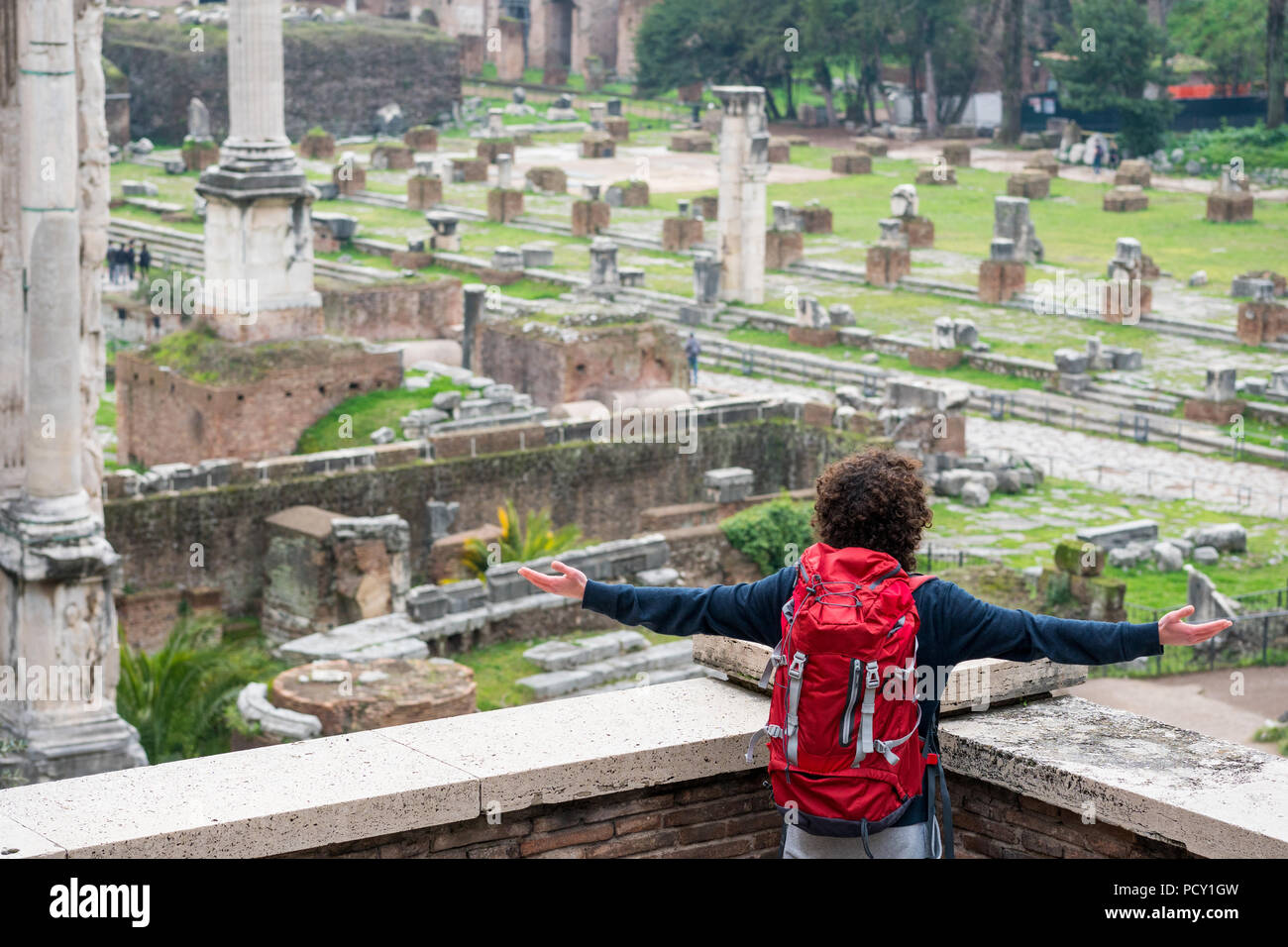 Young backpacker looking at Roman forum in Rome Stock Photo Alamy