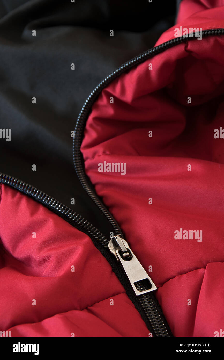 Close up of red down jacket, winter fashion outfit Stock Photo