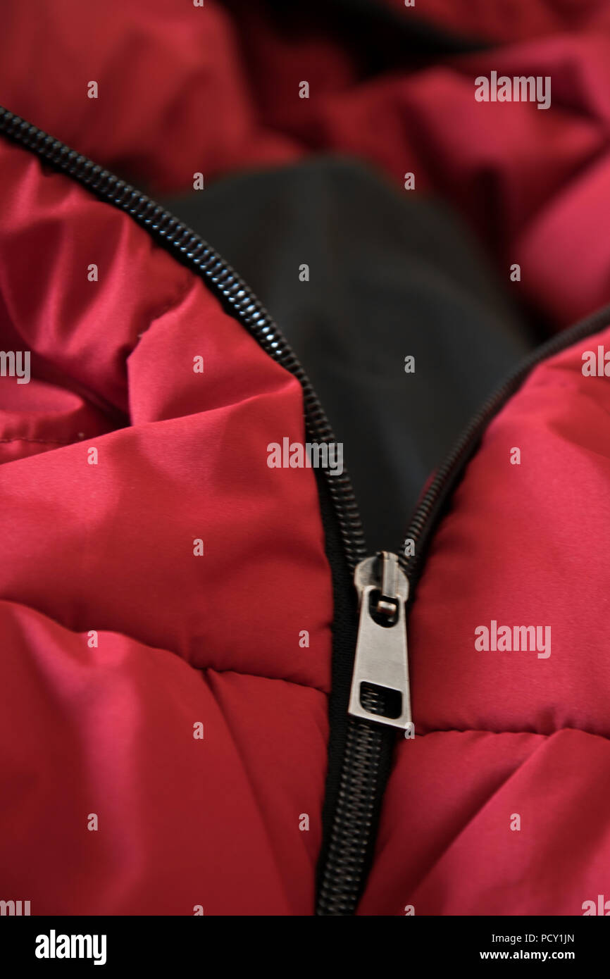 Close up of red down jacket, winter fashion outfit Stock Photo