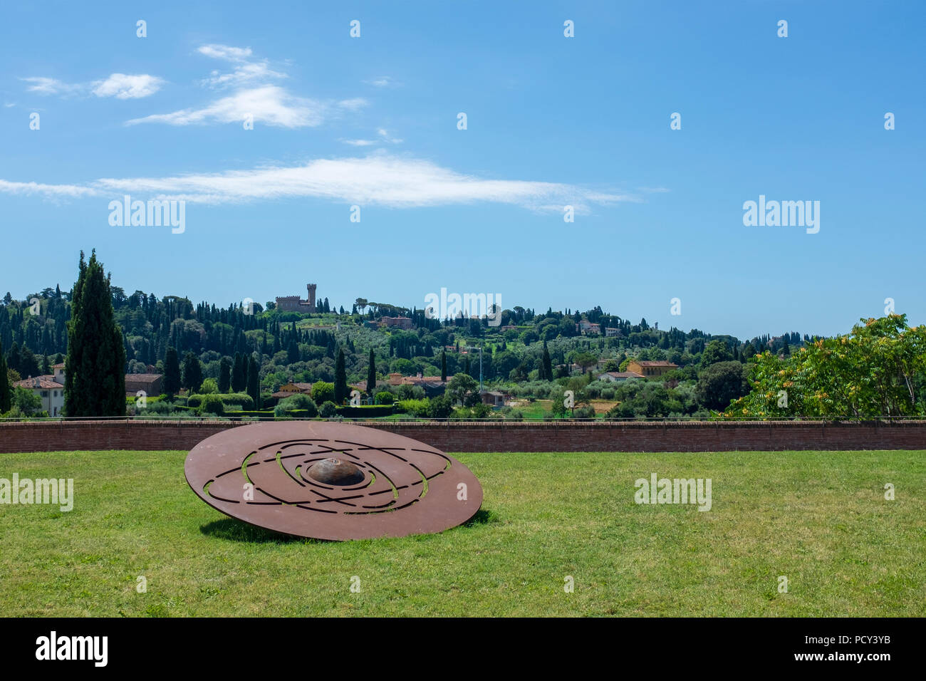 View to Torre del Gallo & Arcetri Hills from Fort Belvedere with Gong artwork / sculpture in foreground Stock Photo