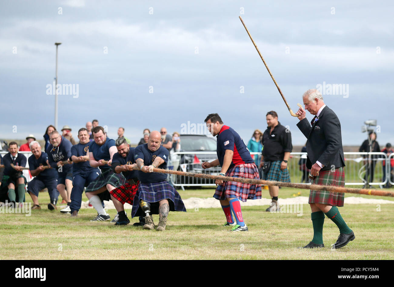The Prince of Wales, known as the Duke of Rothesay in Scotland, judges the tug-of-war with wounded and injured ex-armed forces taking part during the Mey Highland &amp; Cultural Games at the John O'Groats Showground in Caithness. Stock Photo