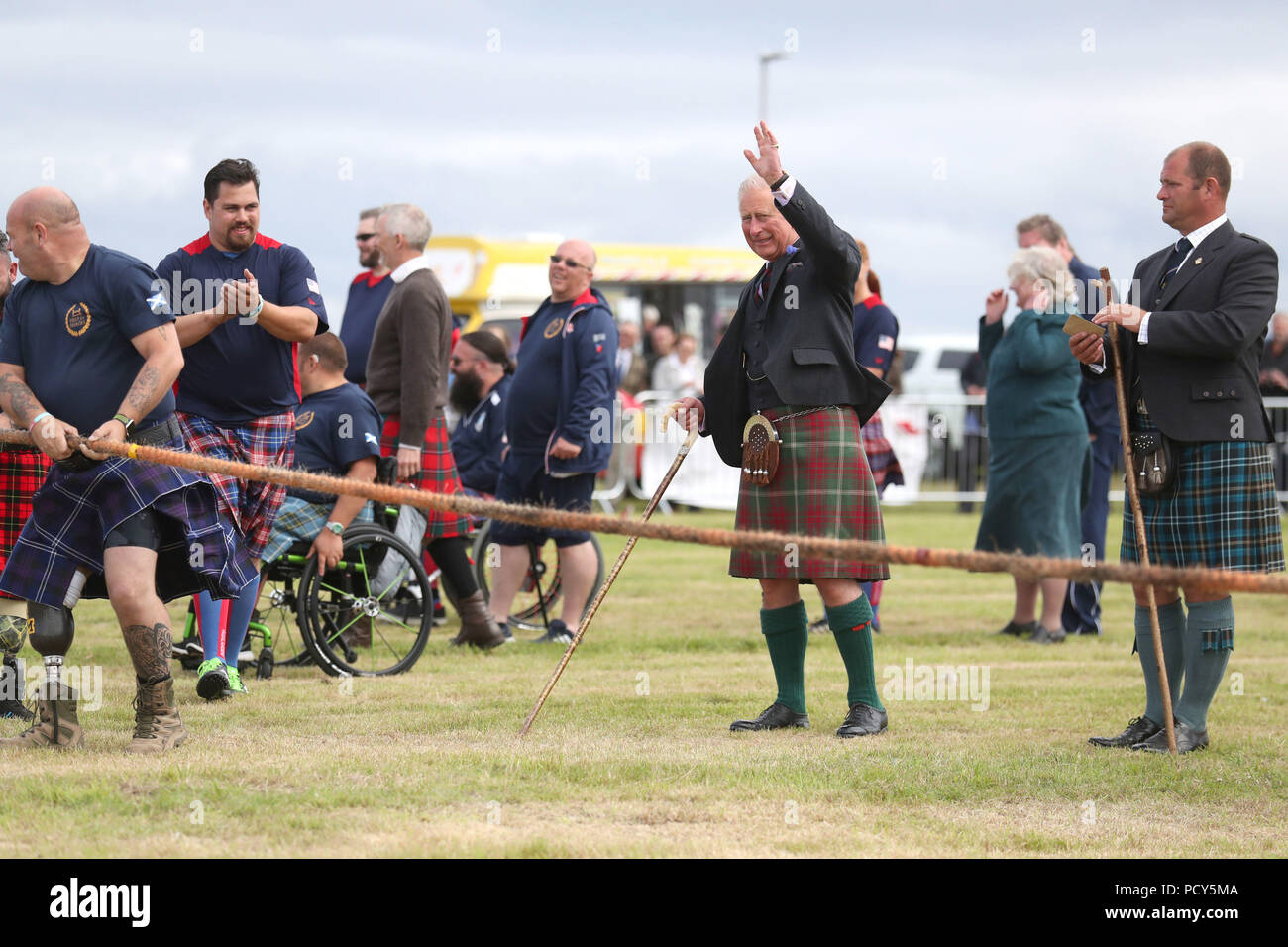 The Prince of Wales, known as the Duke of Rothesay in Scotland, judges the tug-of-war with wounded and injured ex-armed forces taking part during the Mey Highland &amp; Cultural Games at the John O'Groats Showground in Caithness. Stock Photo