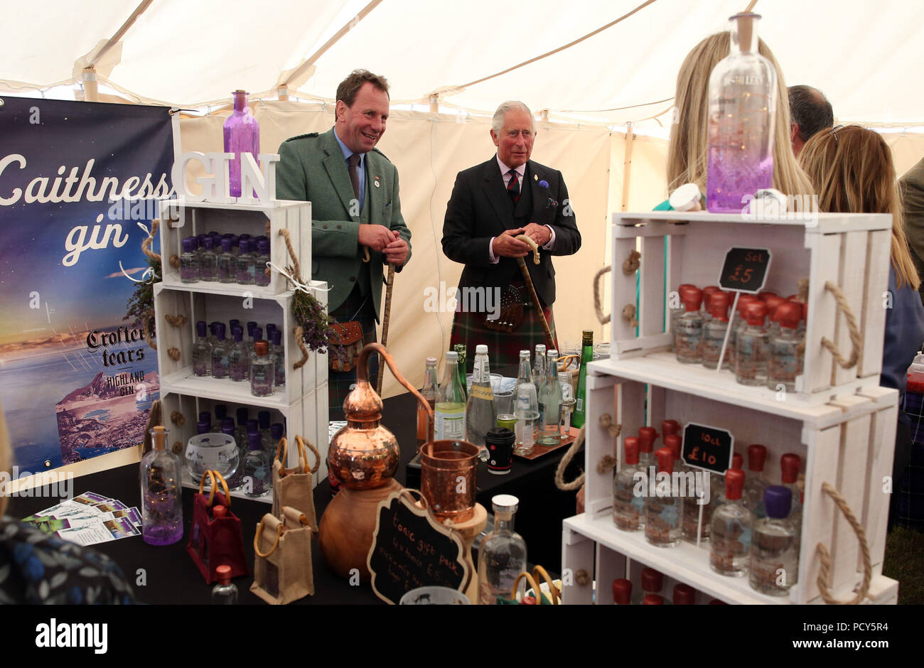 The Prince of Wales, known as the Duke of Rothesay in Scotland, looks at various stalls as he attends the Mey Highland &amp; Cultural Games at the John O'Groats Showground in Caithness. Stock Photo