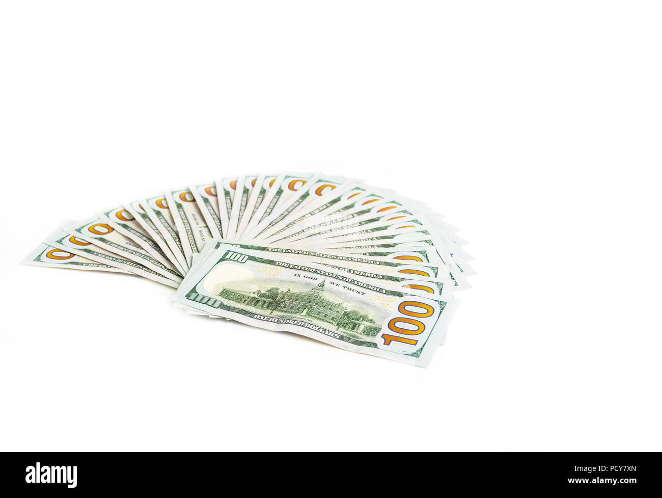 Money, diagonal shot of american one hundred dollar bills isolated on white background sorted as widespread hand fan. Copy space. Stock Photo