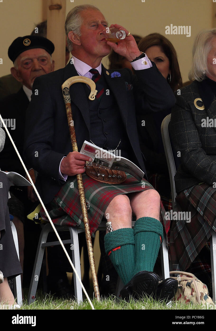 The Prince of Wales, known as the Duke of Rothesay in Scotland, has a dram as he attends the Mey Highland &amp; Cultural Games at the John O'Groats Showground in Caithness. Stock Photo