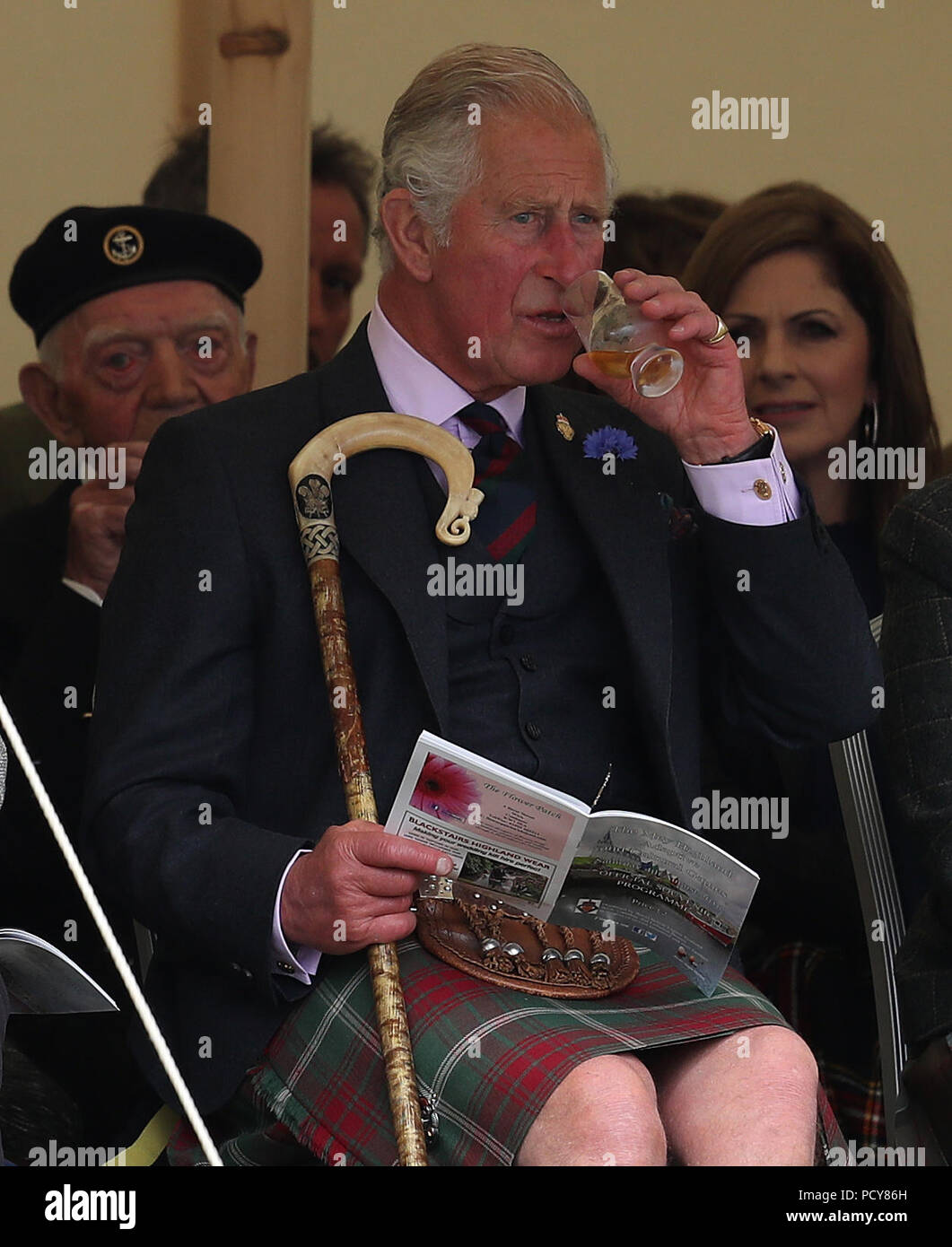 The Prince of Wales, known as the Duke of Rothesay in Scotland, has a dram as he attends the Mey Highland &amp; Cultural Games at the John O'Groats Showground in Caithness. Stock Photo