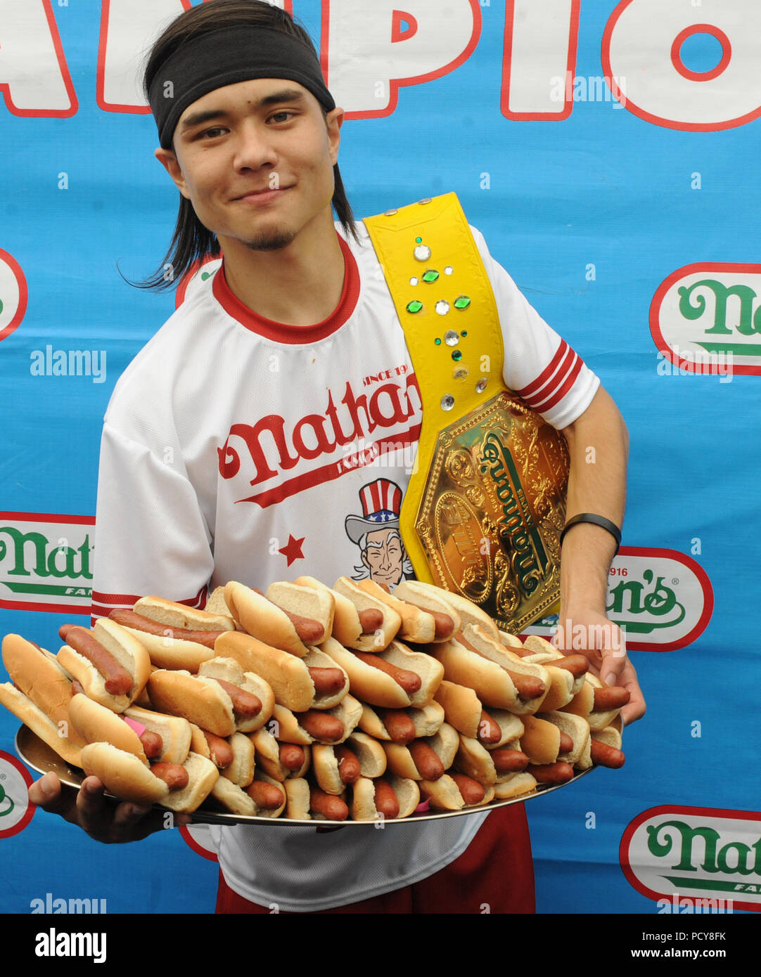 NEW YORK, NY JULY 04 Matt Stonie eats 62 hot dogs to upset Joey