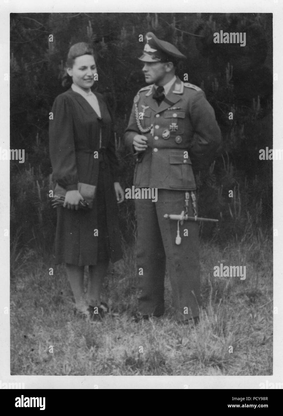 Oberfeldwebel Otto Thomas of 3. Kompanie, Fallschirmjäger-Regiment 2 in walking-out dress, with his fiancé Else in 1941. His awards include the Army Paratrooper Award Badge. Stock Photo