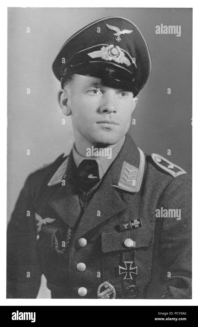 Portrait of Feldwebel Otto Thomas of 3. Kompanie, Fallschirmjäger-Regiment 2, wearing his Iron Cross 1st Class, Army Paratrooper Award Badge, Black Wound Badge and ribbon bar including the Long Service Award IVth Class and Commemorative Medal of 1st October 1938 with Prague Castle Bar. Probably taken in the summer of 1940 after the Battle of France. Stock Photo