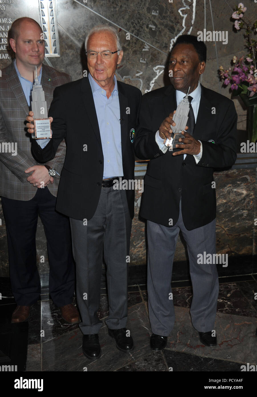 NEW YORK - APRIL 17: Soccer legend Pele Cosmos and Franz Beckenbauer will “flip the switch” to light the world-famous Empire State Building “Cosmos green” to launch and celebrate the start of the team’s 2015 spring season on April 17, 2015 in New York City.   People:  Pele Cosmos, Franz Beckenbauer Stock Photo