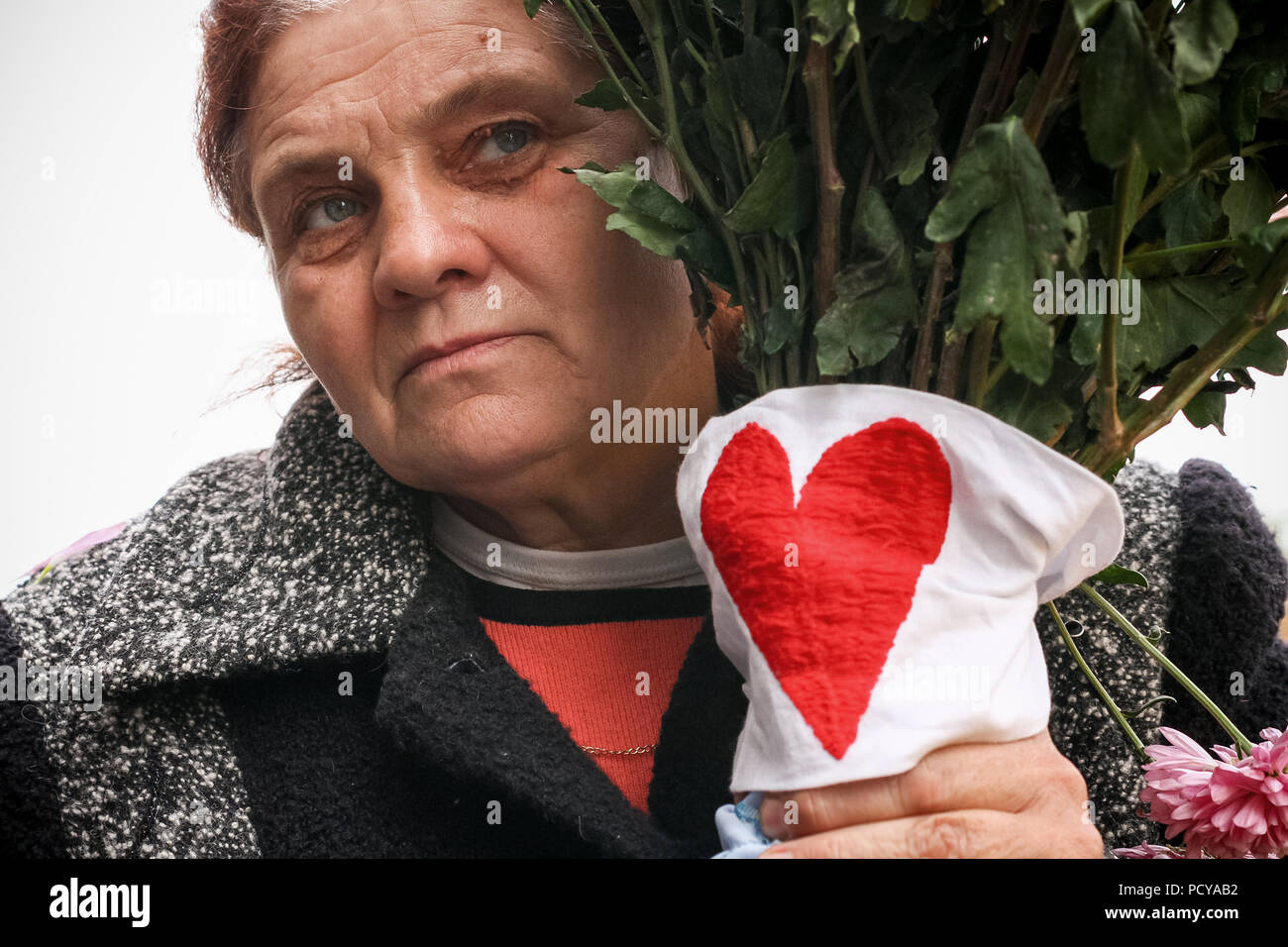 Supporter of Yulia Tymoshenko with flowers and love heart in Kiev, Ukraine Stock Photo