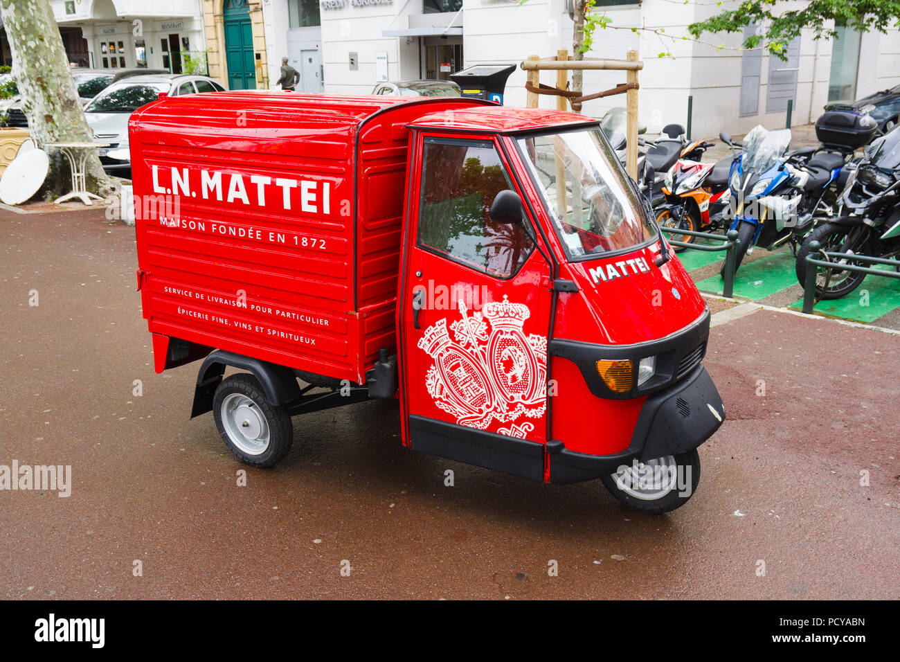 Piaggio Ape 50 three-wheeled vehicle used for deliveries by L.N. Mattei distillery in Bastia, Corsica, France Stock Photo
