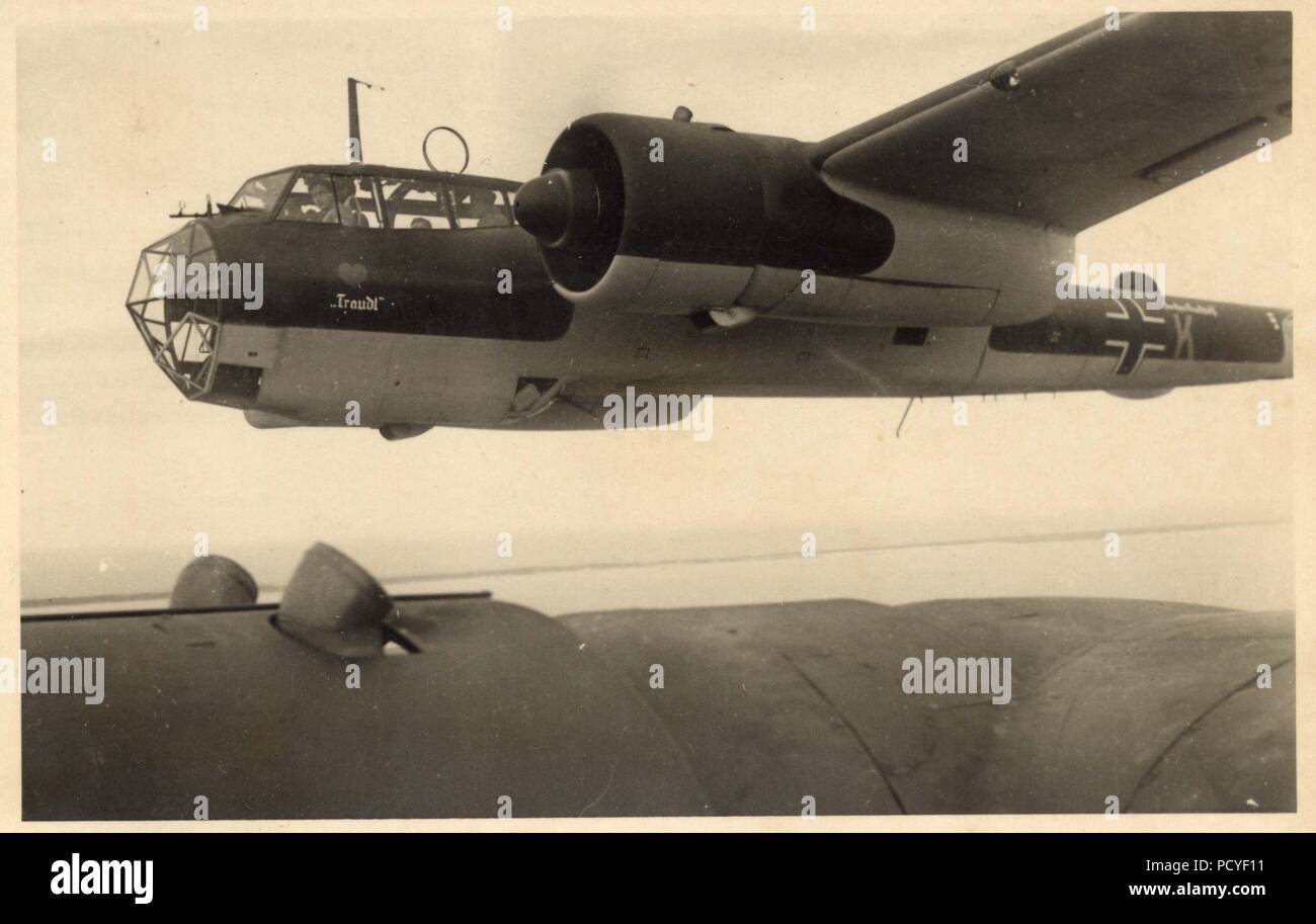 Image from the photo album of Oberfeldwebel Gotthilf Benseler of 9. Staffel, Kampfgeschwader 3: Dornier Do17Z-2s of 9. Staffel, Kampfgeschwader 3 in formation in 1940. The subject aircraft is armed with machine-guns and carrying wartime codes. It bears the personal name 'Traudl' and carries the 'Red Heart' Staffel Badge of 9./KG 3. Stock Photo