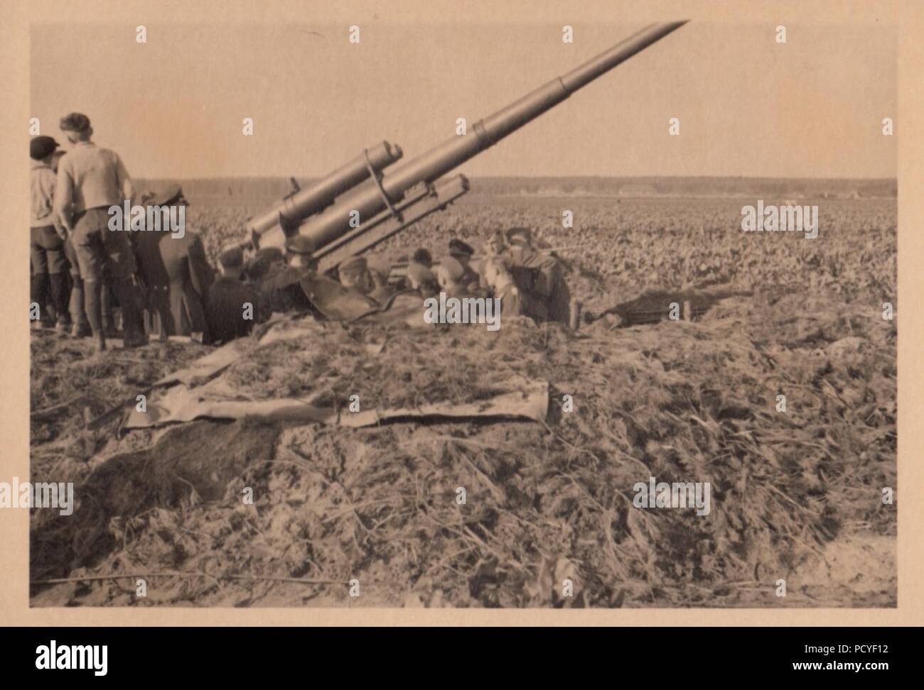 Image from the photo album of Oberfeldwebel Gotthilf Benseler of 9. Staffel, Kampfgeschwader 3: An 88mm anti-aircraft gun emplacement, defending an airfield. Stock Photo