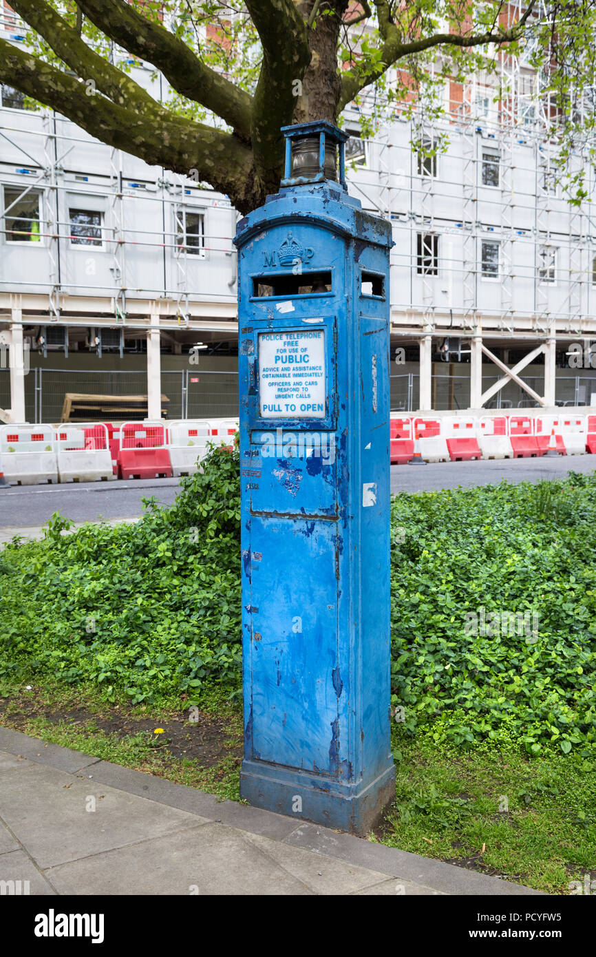 A blue police telephone box in London, UK Stock Photo