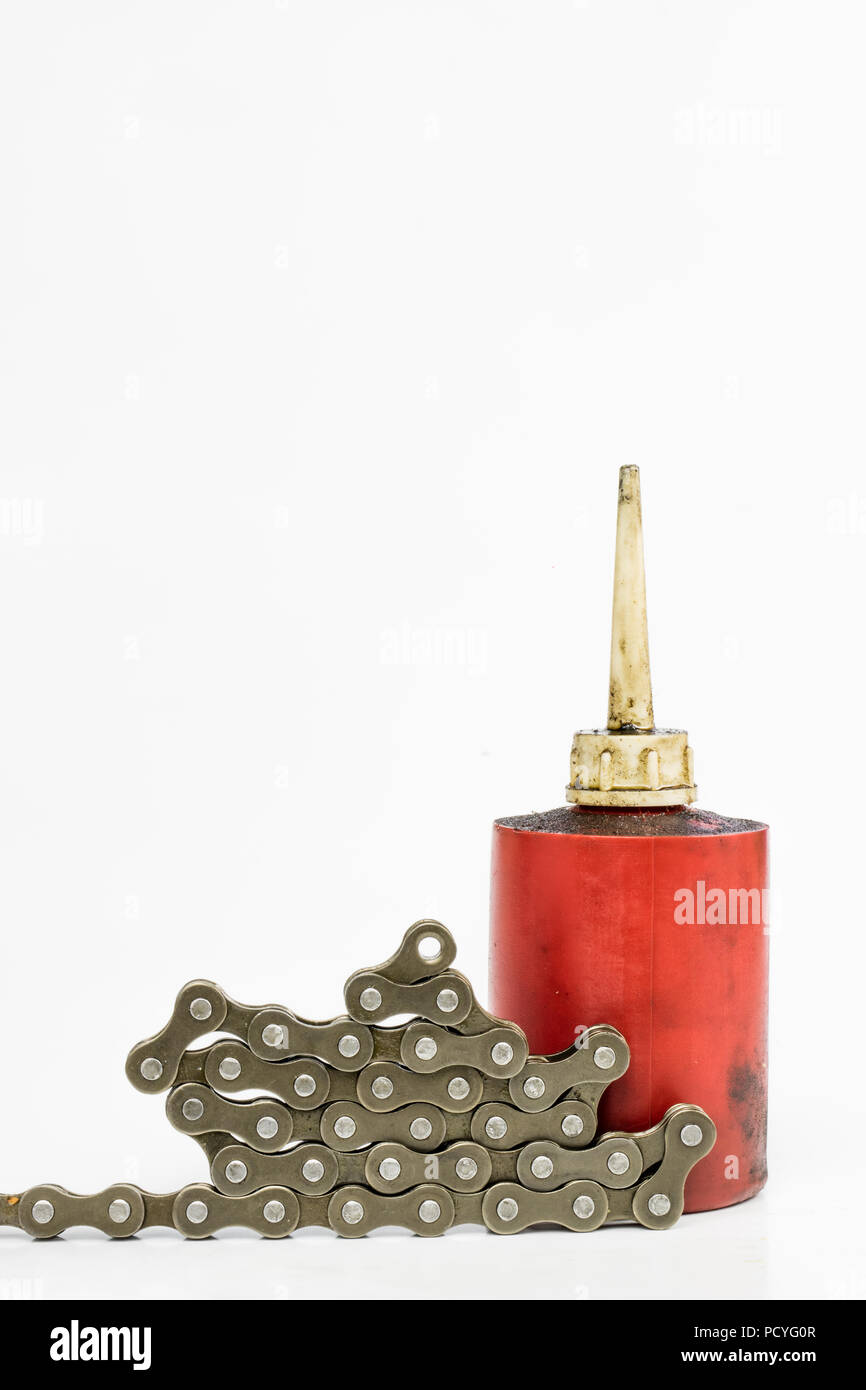 Lubricating the bicycle chain with liquid lubricant. Periodic servicing