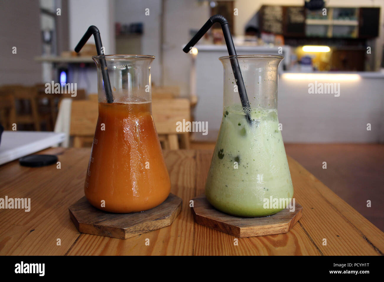 Two cups (or "Tubes") of Matcha Latte and iced Thai tea served at a