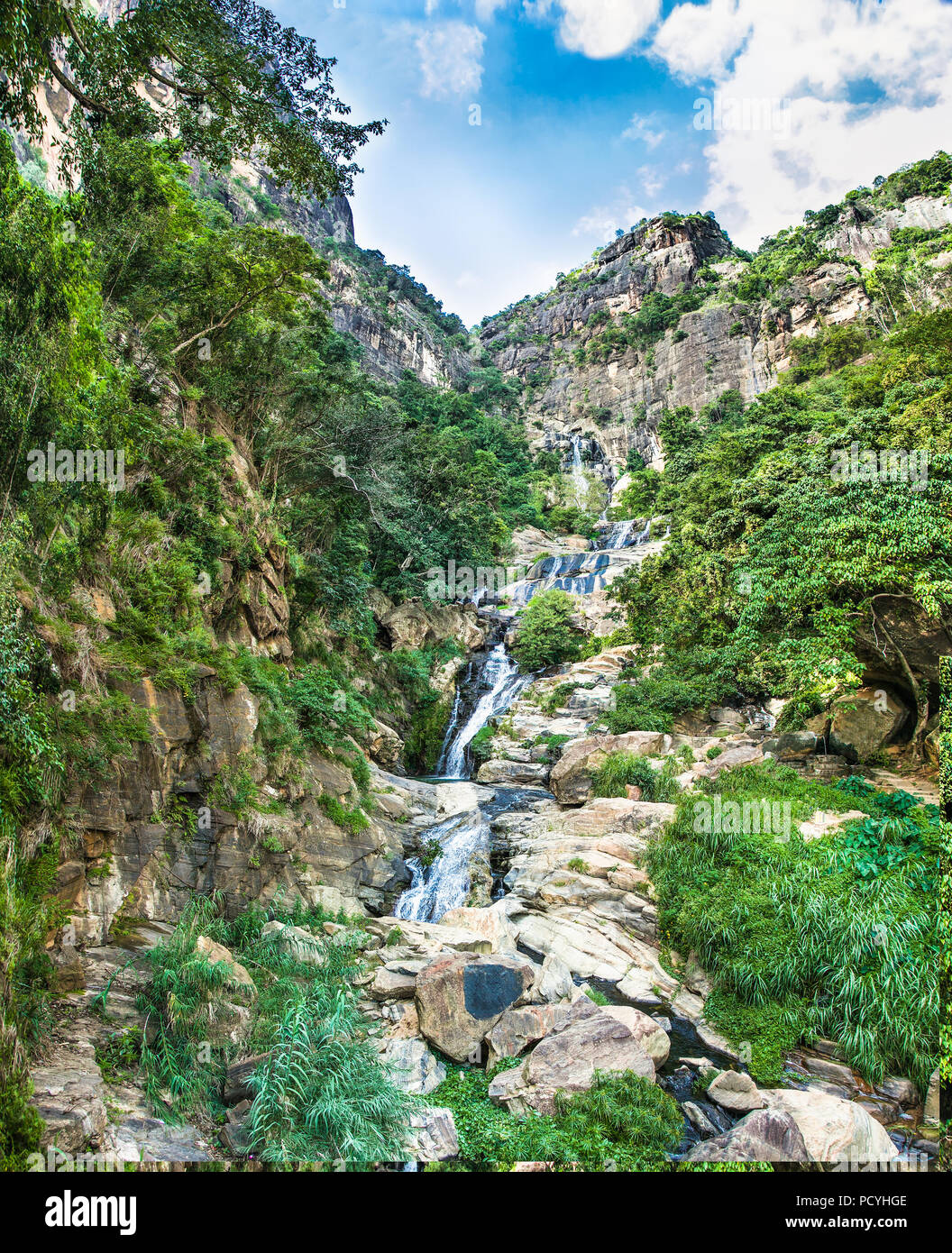 Ravana Falls or Ravana Ella waterfalls is a popular sightseeing attraction near Ella Sri Lanka. Ravana Falls ranks as one of the widest falls in Sri L Stock Photo