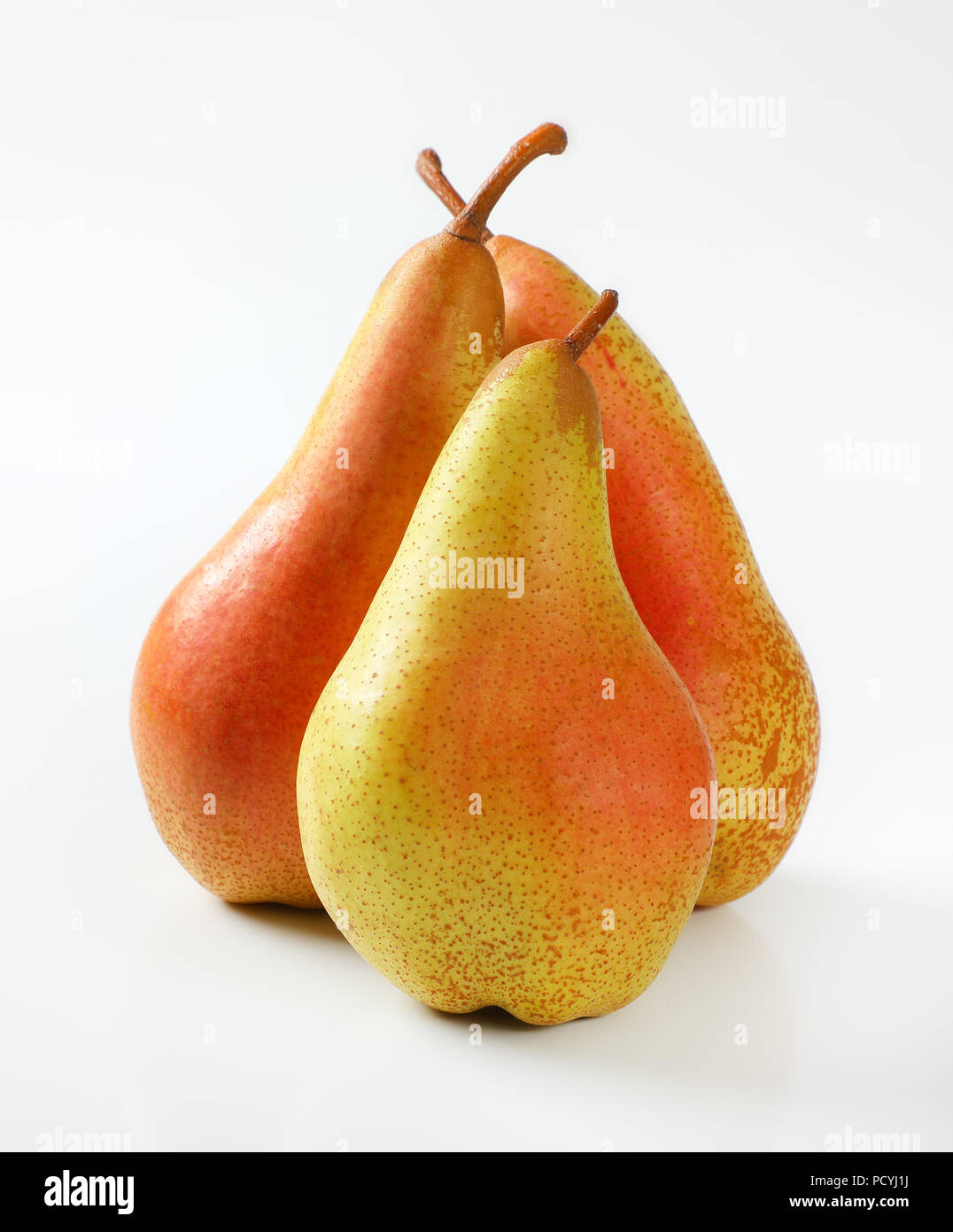 three ripe pears on white background Stock Photo