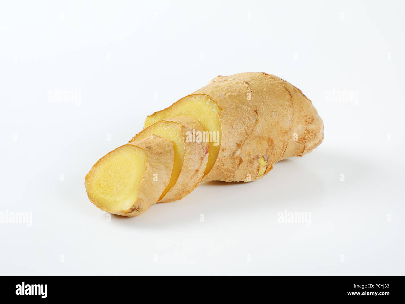 sliced ginger root on white background Stock Photo