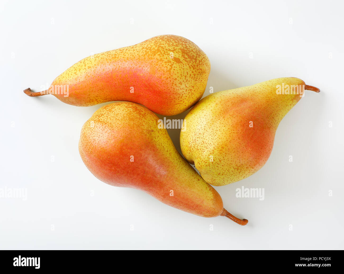 three ripe pears on white background Stock Photo