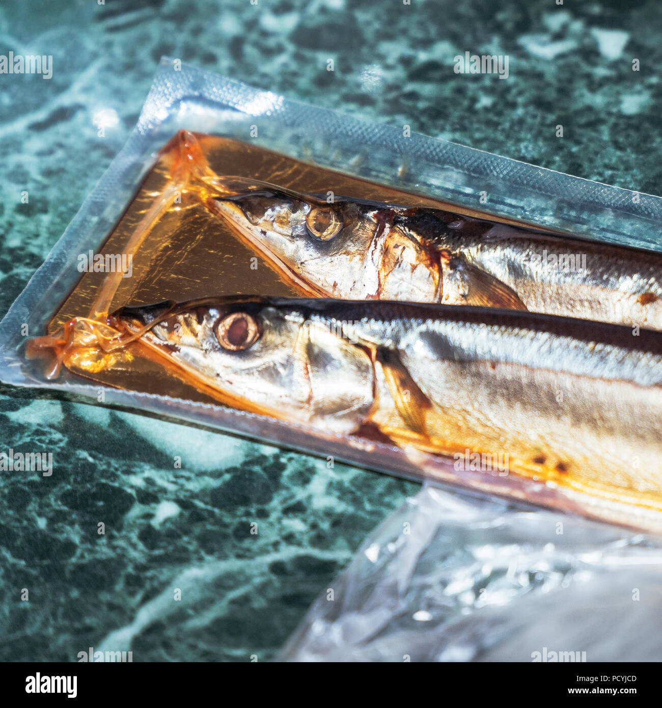 Sea fish saury in vacuum packaging Stock Photo Alamy