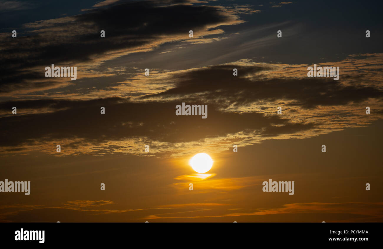 sunset sky with big sun Stock Photo