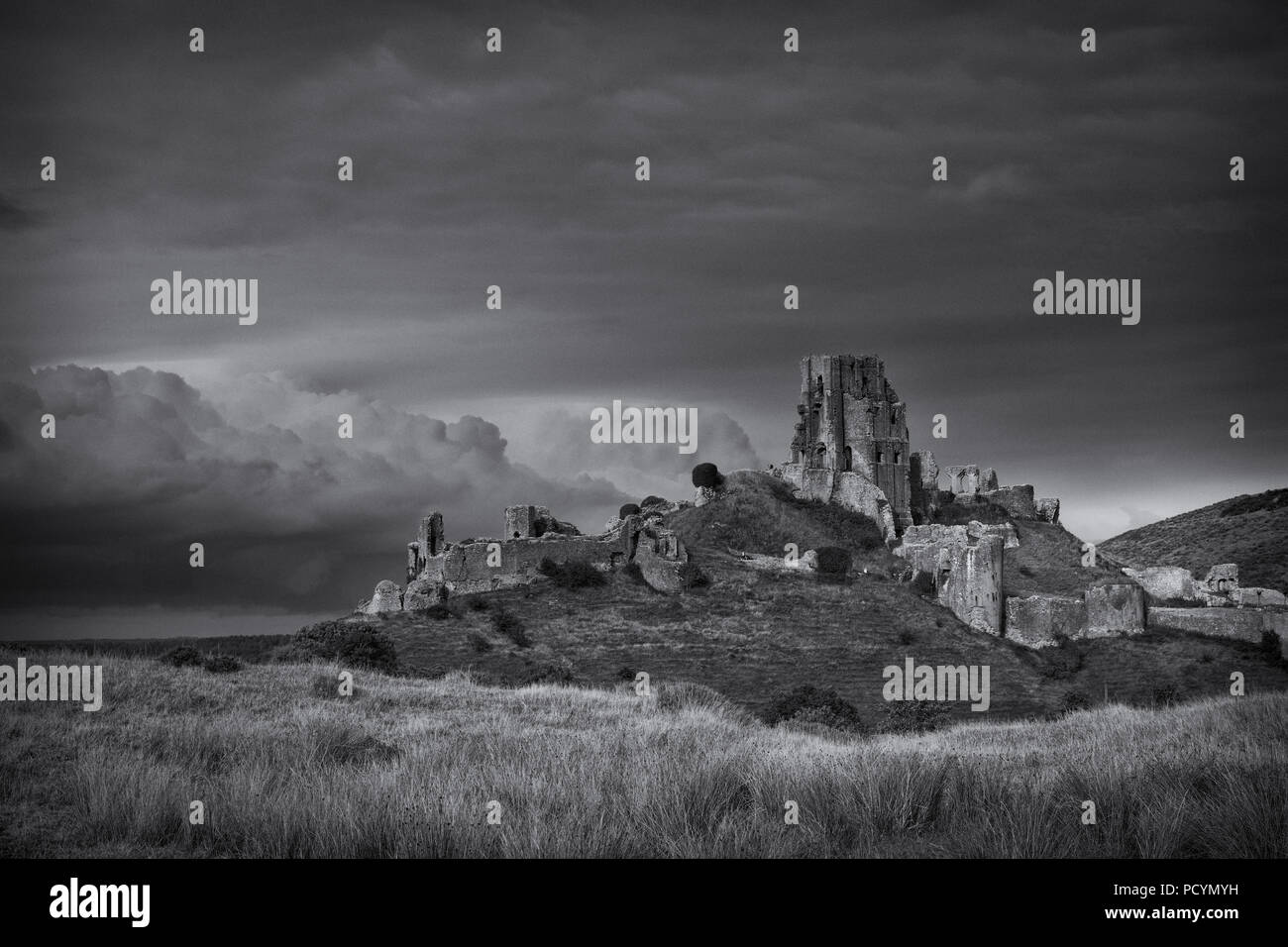 A moody Black and White view of Corfe Castle at Wareham in Dorset Stock Photo