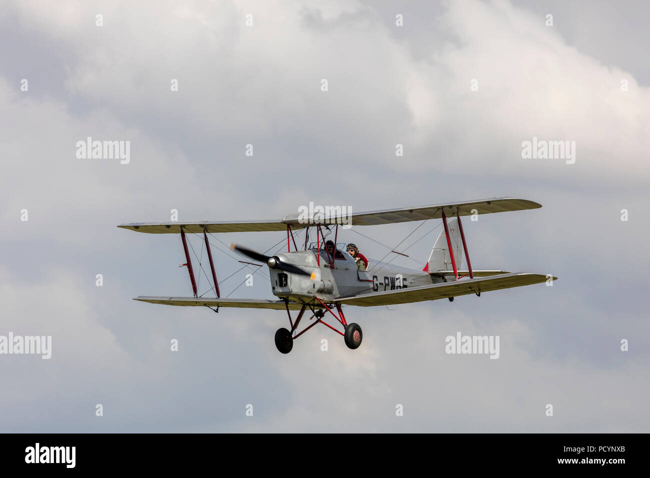 A Tiger Moth G-PWBE in flights and coming into land Stock Photo