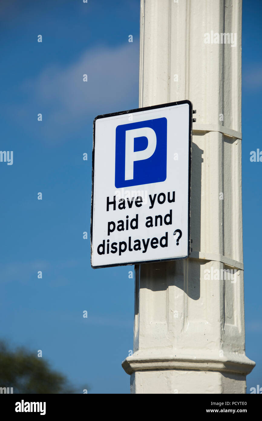 Parking signs and machines on streets of Southport Stock Photo