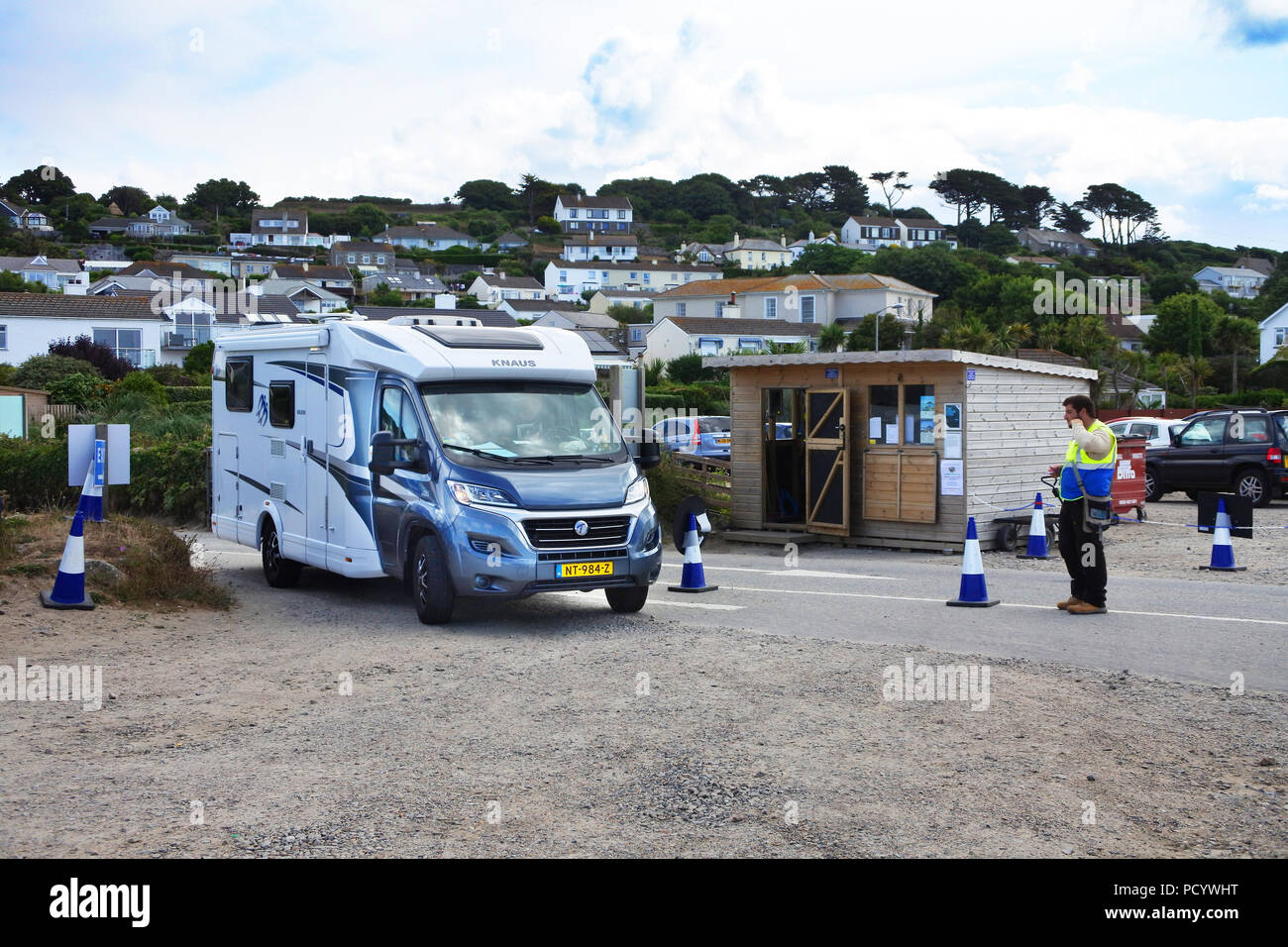 Car parkers collecting money at the entrance to the main St. Michael's Mount car park, Marazion, Cornwall, UK - John Gollop Stock Photo