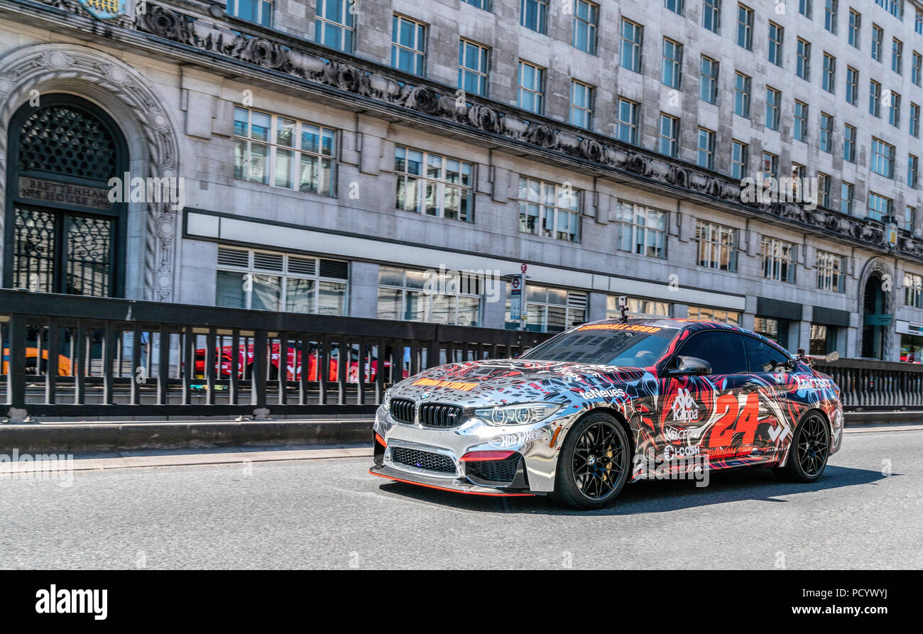 5 August 2018 - London, England. Powerful BMW M4 car wrapped in colorful vinyl participating in Gumball Rally 3000 event. Stock Photo