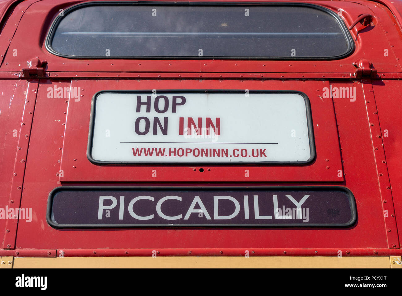 Old London bus converted to mobile bar and pub called the Hop on Inn Stock Photo