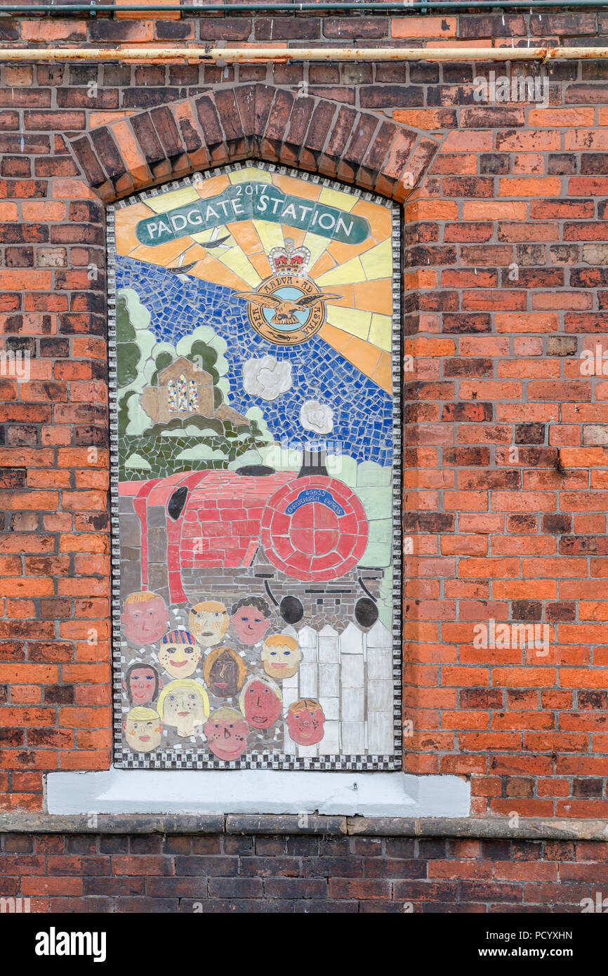 A no-longer used window has been decoratively pictured with a mosaic of The Christchurch Express train at the Historic Railway Station of Padgate, War Stock Photo