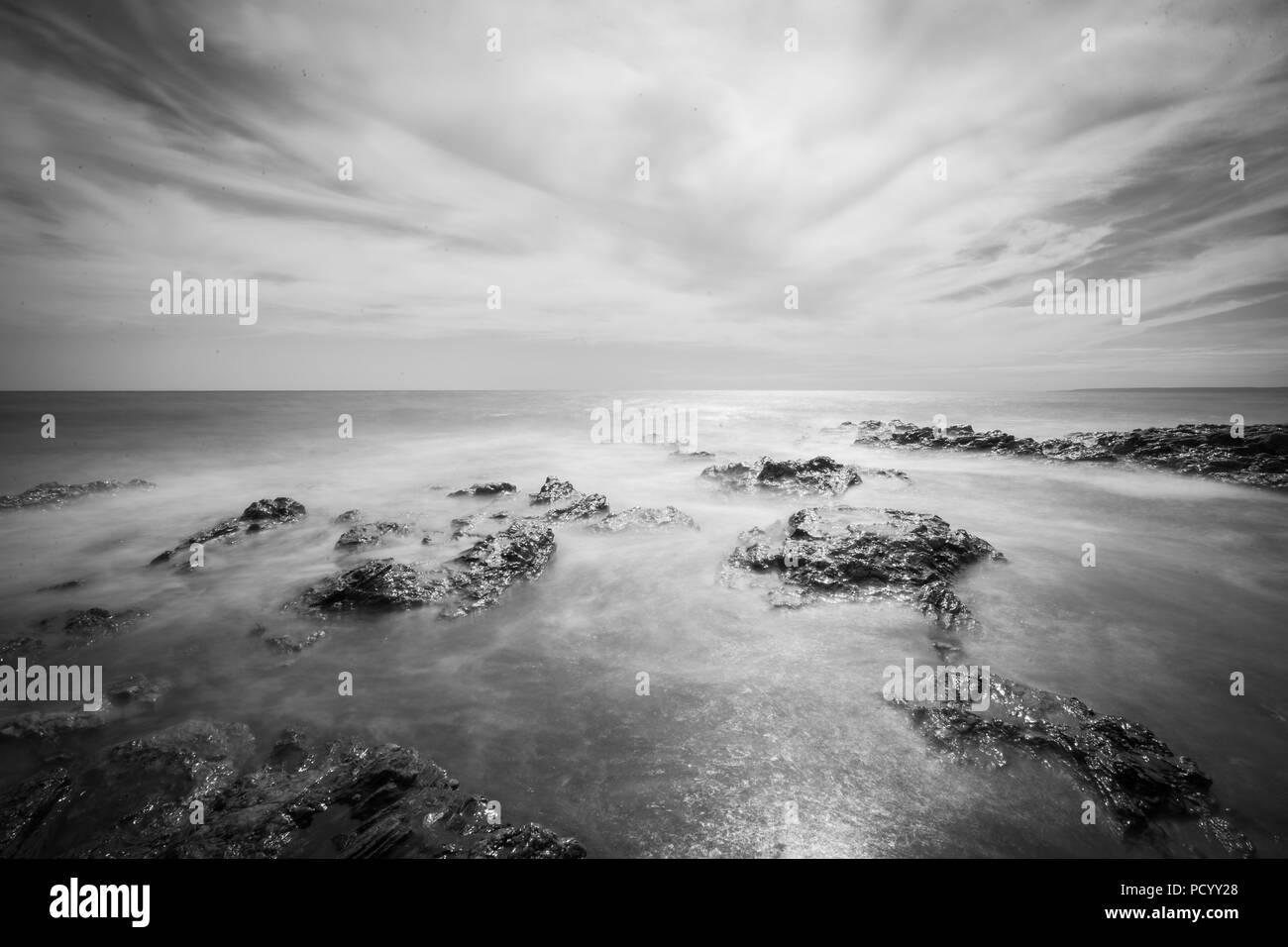 Porthleven beach, long exposure monochrome image Stock Photo - Alamy