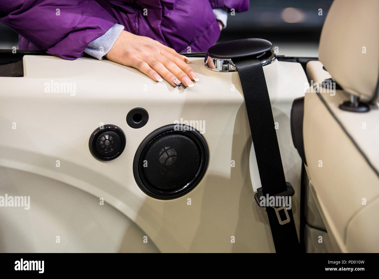 Car speakers and woman's hand Stock Photo - Alamy