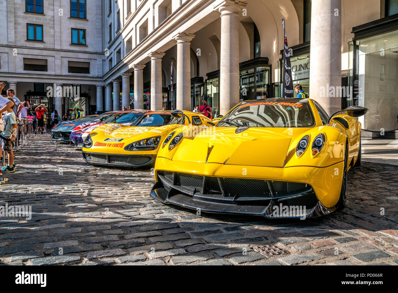 4 August 2018 - London, England. Unique supercar display in Covent Garden. Yellow Pagani Zonda and other cars participating in Gumball 3000 rally Stock Photo