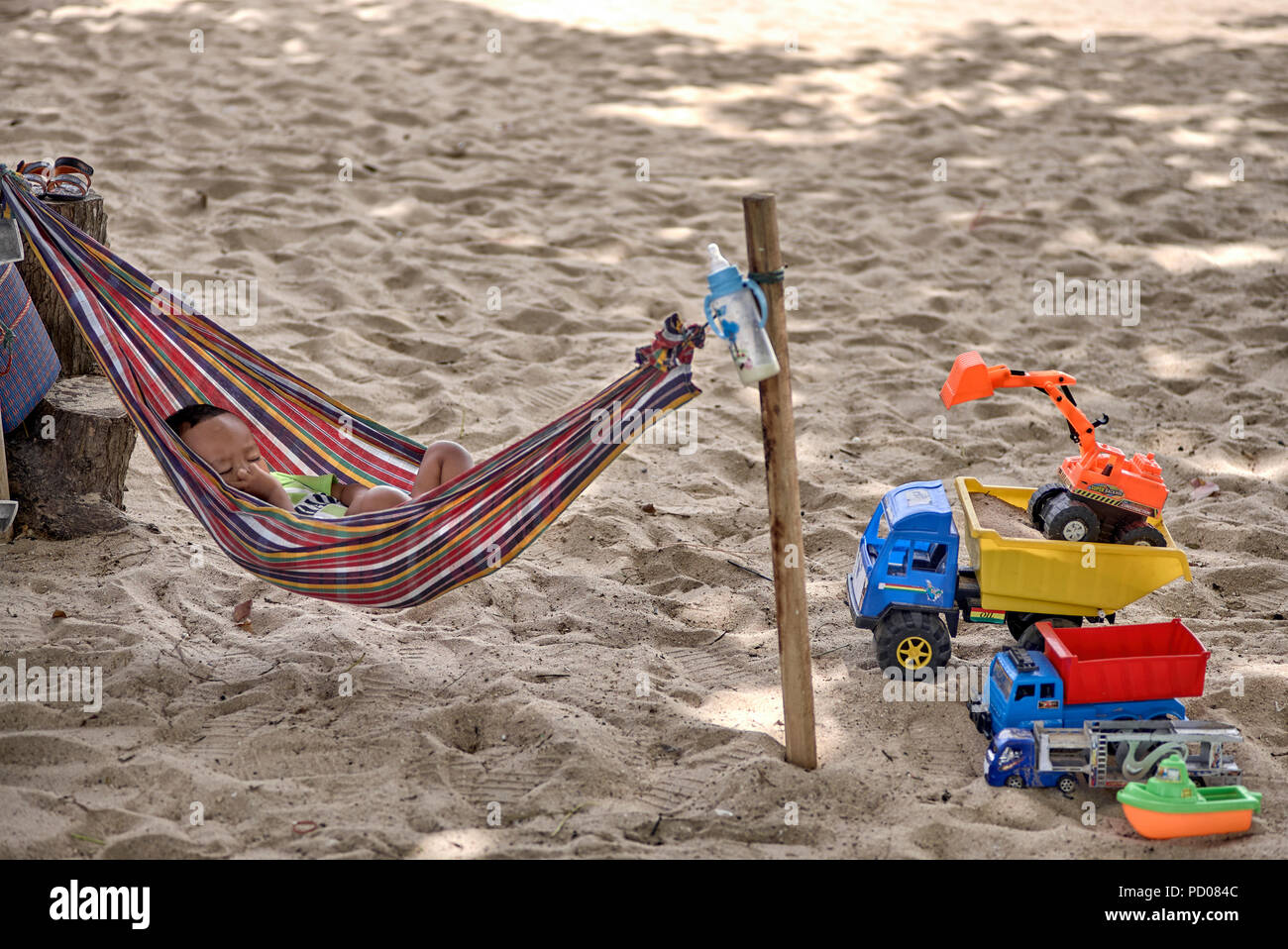 Child sleeping in a hammock on the beach at Pattaya Thailand Southeast Asia Stock Photo Alamy