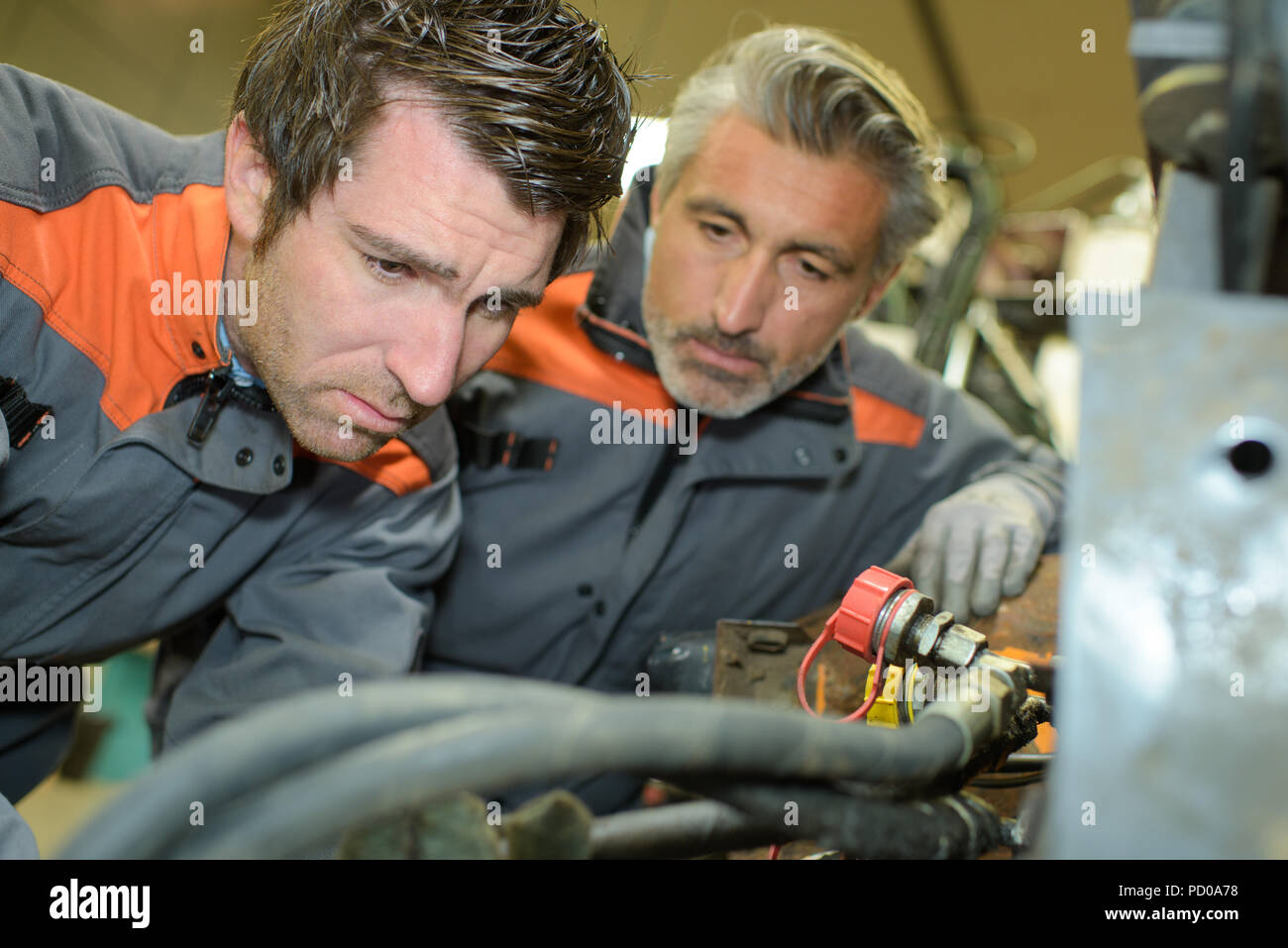 solving a machine problem Stock Photo - Alamy