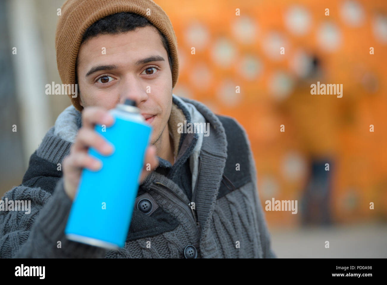 young graffiti artist with spray paint Stock Photo Alamy