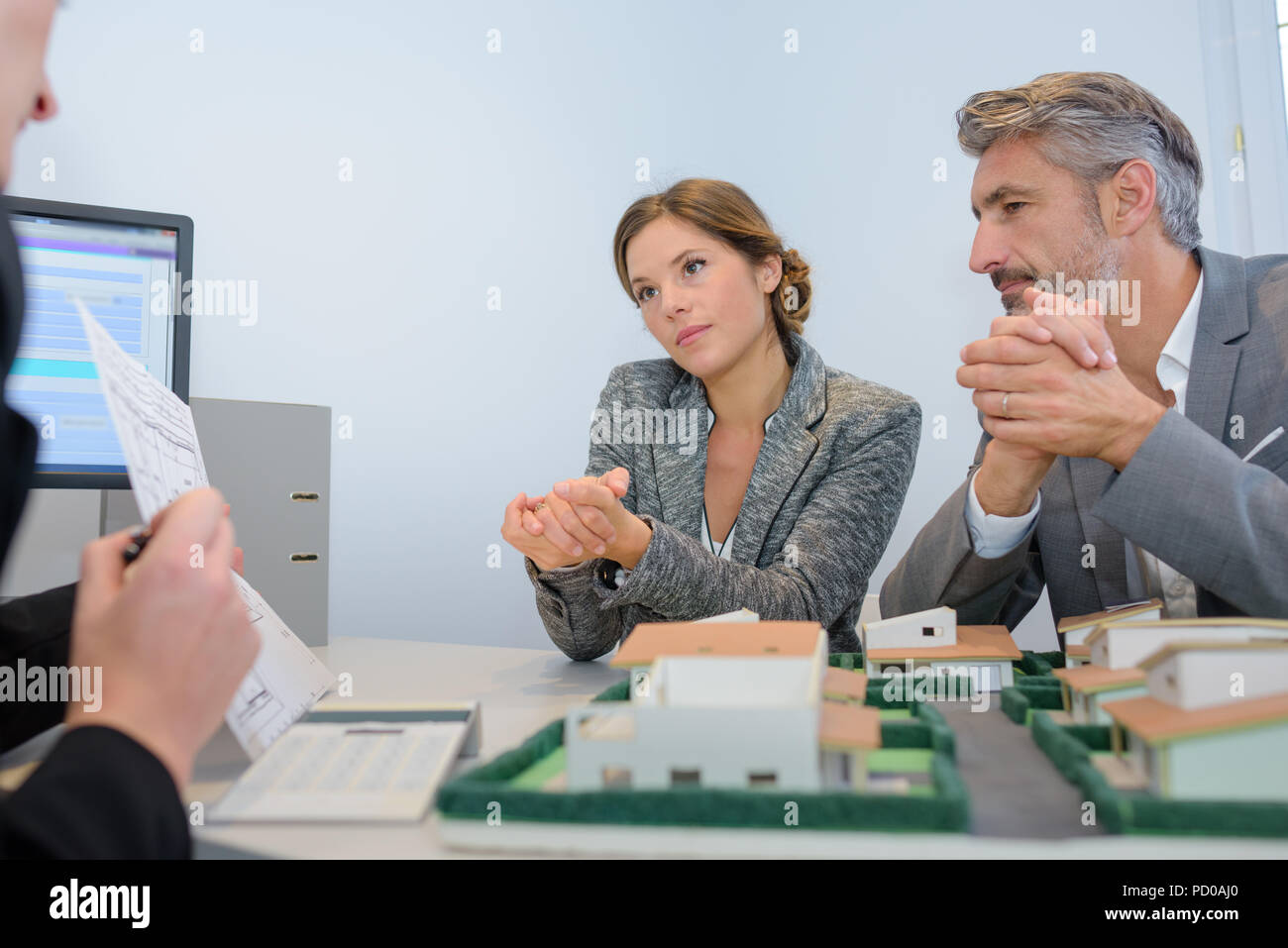 Executives discussing property development Stock Photo Alamy