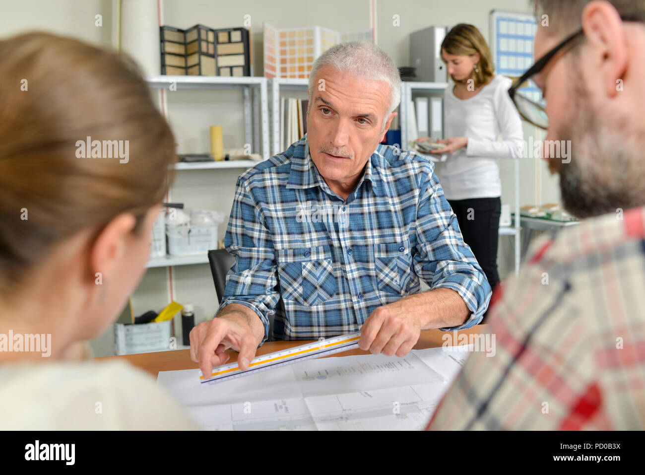 Architect explaining something to client Stock Photo - Alamy
