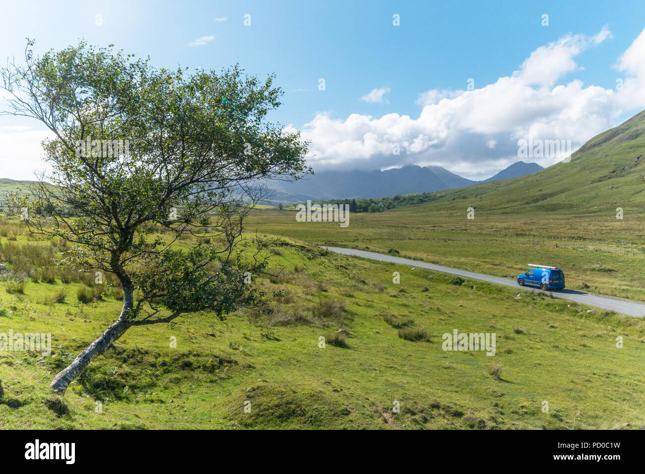 A car drives through the Scottish Highlands, Scotland, UK Stock Photo