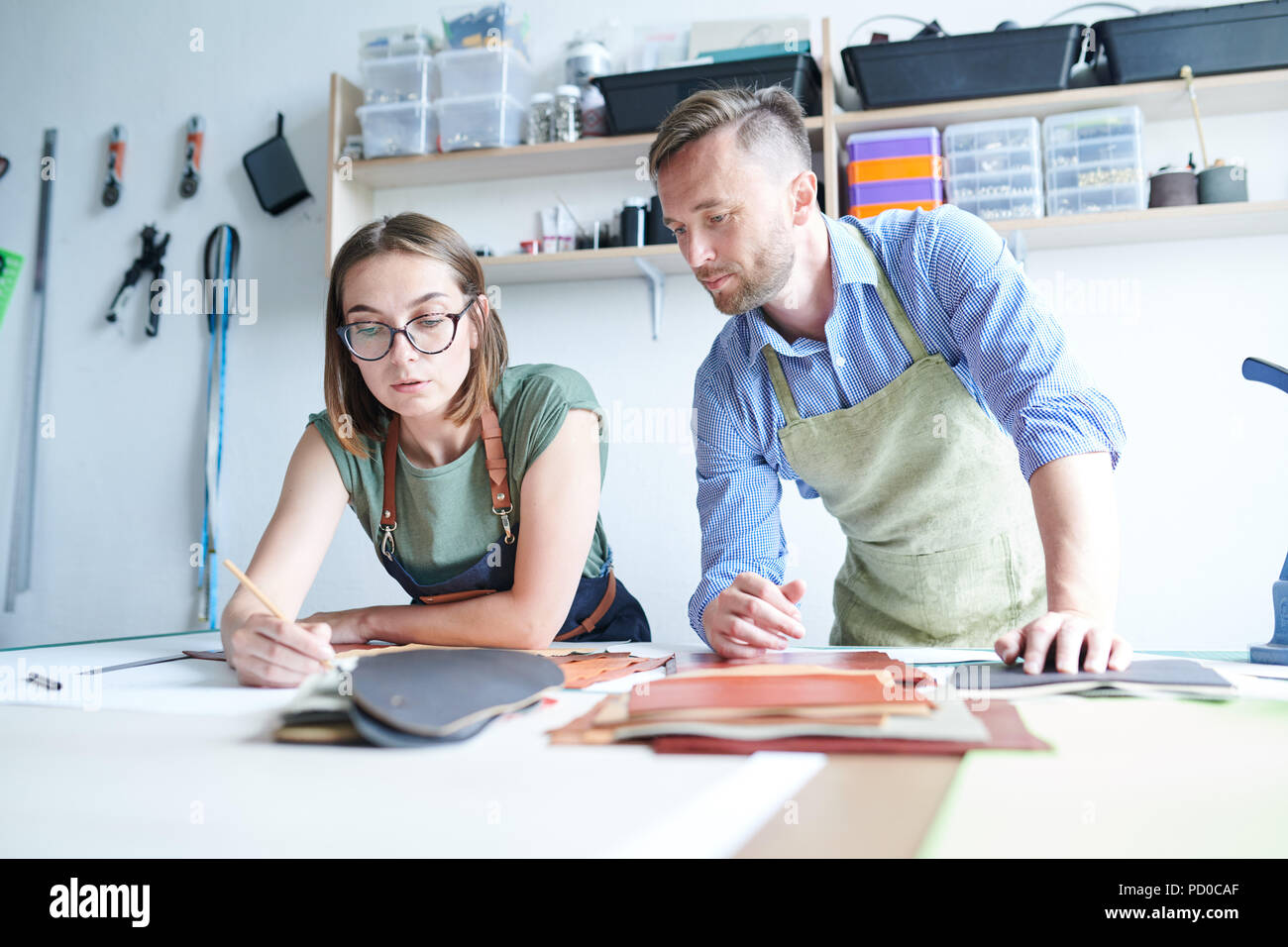 Team of tailors working with leather Stock Photo Alamy