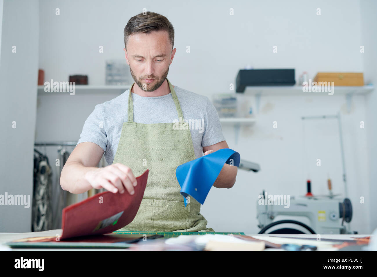 Clothier working in workshop Stock Photo