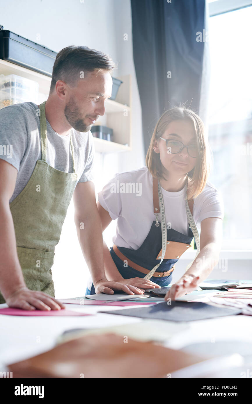 Working in team to create leather products Stock Photo