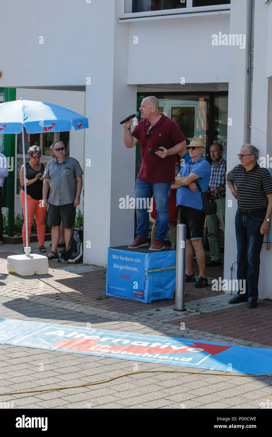 Hassloch, Germany. 04th Aug, 2018. The vice parliamentary leader of the AfD party in the Landtag (parliament) of Rhineland-Palatinate Joachim Paul addresses the rally. The Rhineland-Palatinate parliamentary party of the right-wing AfD (Alternative for Germany) protested in Hassloch against immigrants, especially a Somalian refugee who was court ordered to remain in Hassloch, despite his asylum application having been rejected. A counter-protest was organised by several groups. Credit: Michael Debets/Pacific Press/Alamy Live News Stock Photo