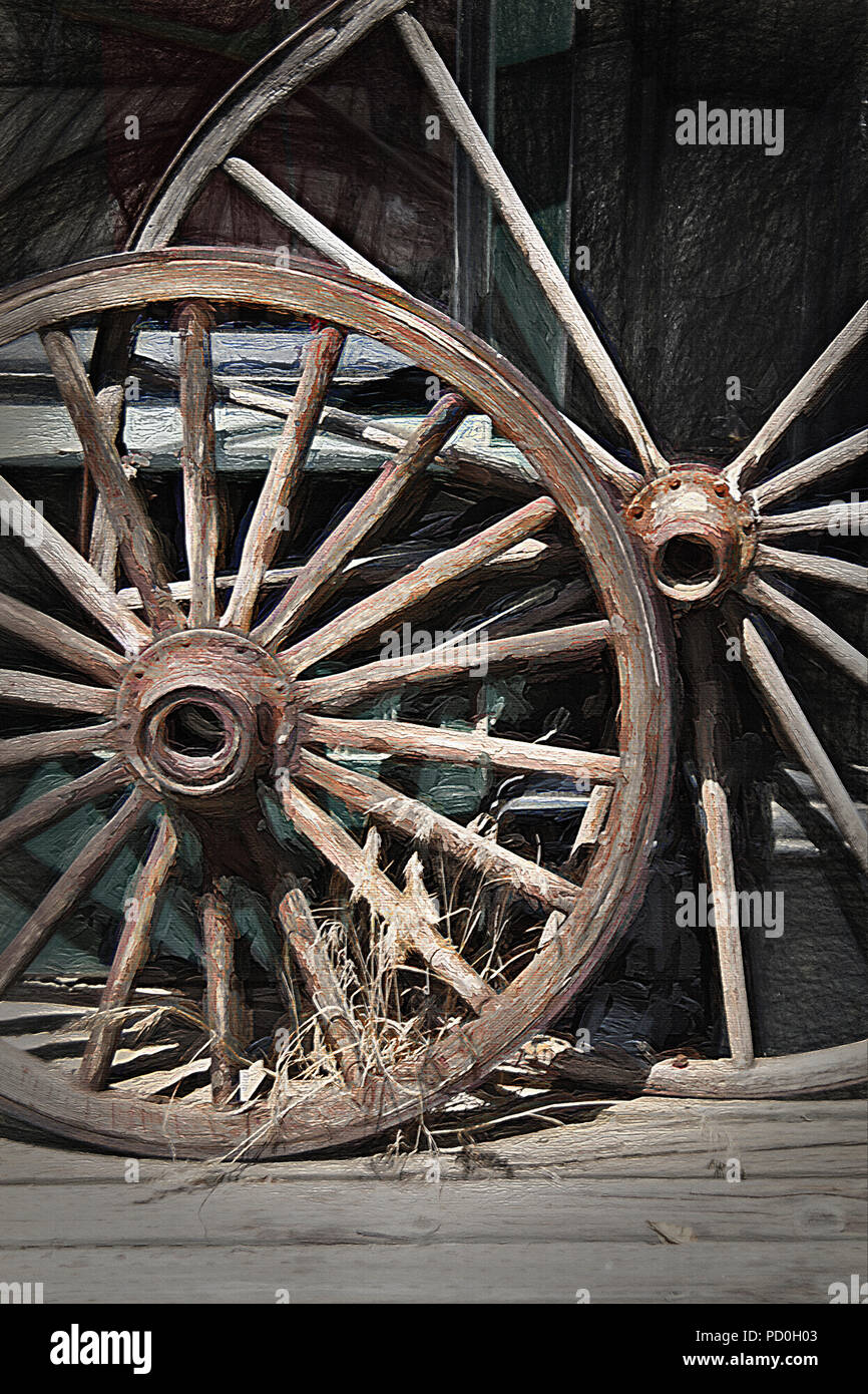 This still life of old, rustic wagon wheels was taken at Pioneer Village in Salt Lake City, Utah during the local celebration (on July 24th) of Mormon Stock Photo